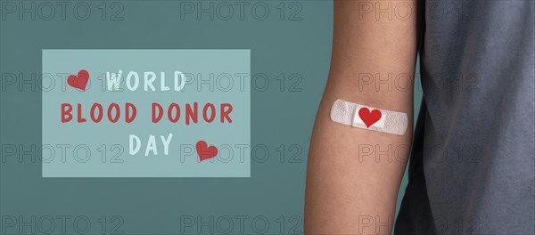 Arm with plaster and heart, blood cells, donate plasma, world blood donor day, health care,