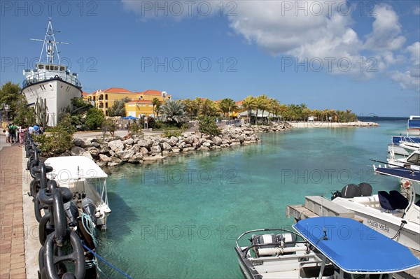 View of shallow inlet between small islands through lagoon in the background orange-coloured