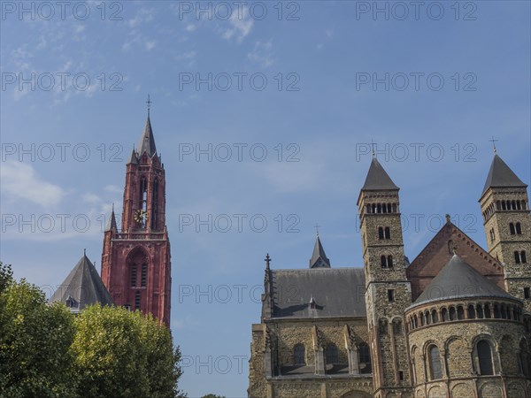 View of the towers and the roof of a historic cathedral under a clear sky, Maastricht, limburg,