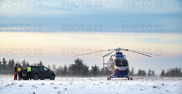 Air rescue helicopter from Luxembourg, emergency transport in Trier, misson in snow, winter