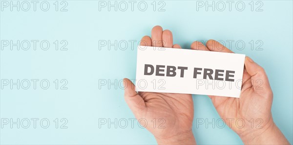 Debt free in process, ending credit payments and bank loans, financial freedom, message on paper