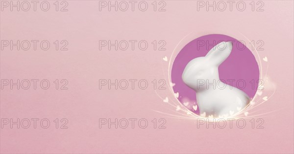 Curious easter bunny or rabbit peeking through a hole, holiday in spring, greeting card with little
