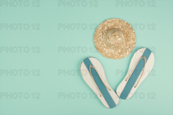 Summer vacation by the sea, flip flops and a straw hat, travel and tourism concept