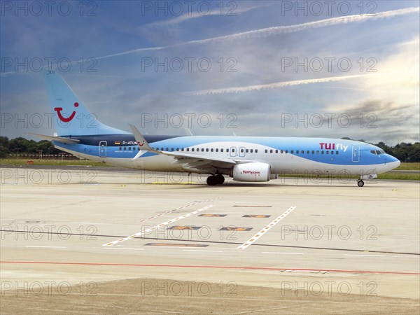 Boeing 737-800 of TUIfly taxiing on Taxi Way taxiway to runway of Düsseldorf International Airport,