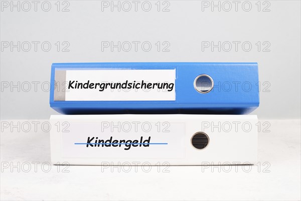 Basic child benefit stands in german language on the file folder, new payment regulation for family