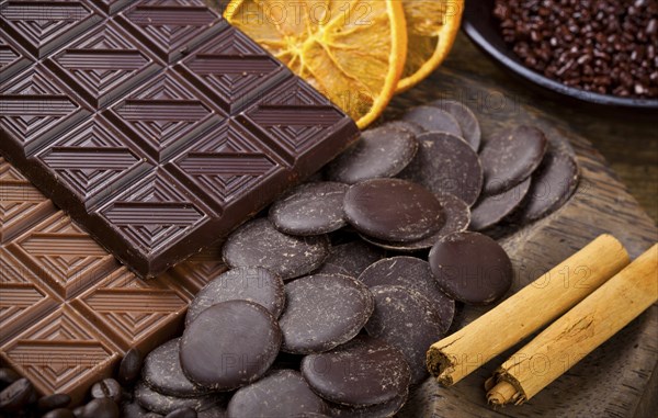 Chocolate with sliced dried orange and cinnamon sticks