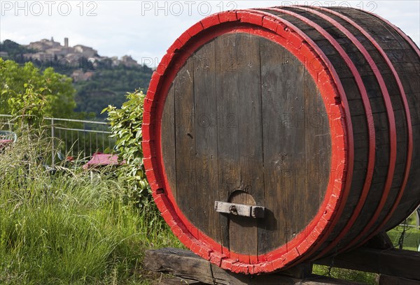 Wine barrels and the hilltop town of Montepulciano, Tuscany, Italy, Europe