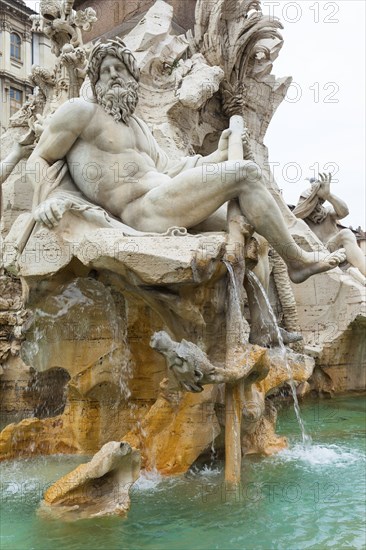 Statue of the god Zeus in Bernini's Fountain of the Four Rivers in Piazza Navona, Rome. Detail of
