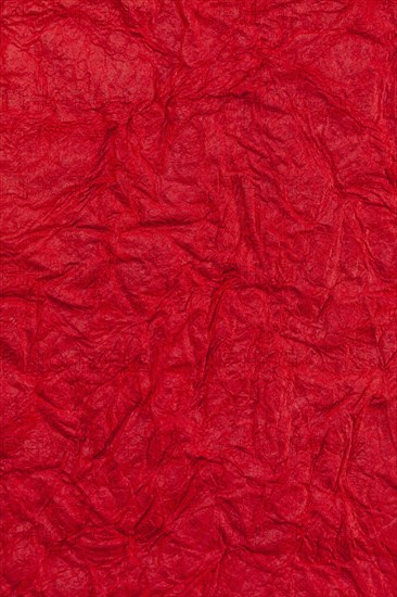 Background surface of wrinkled red and crumpled paper