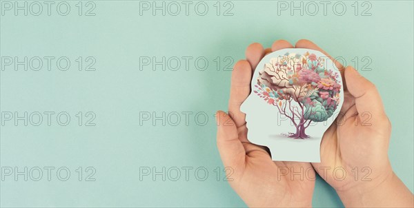 Hands holding head, human brain with flowers, self care and mental health concept, positive