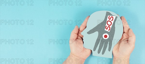 Domestic violence, hand hits face, sos on exclamation mark, international awareness month october