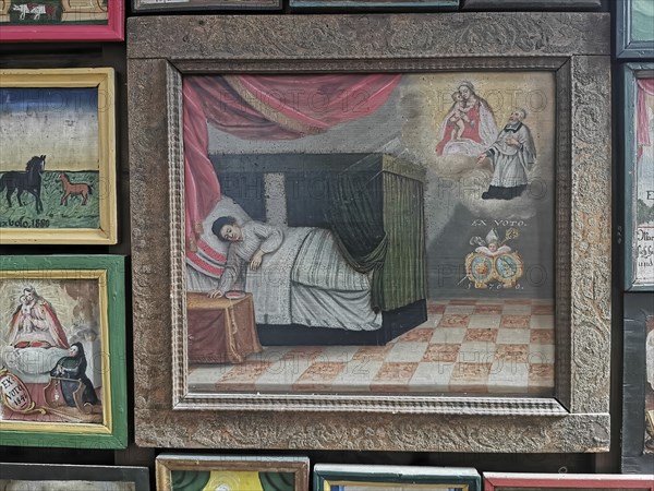 Votive pictures, votive tablets on the walls of the chapel of grace inside the church, pilgrimage