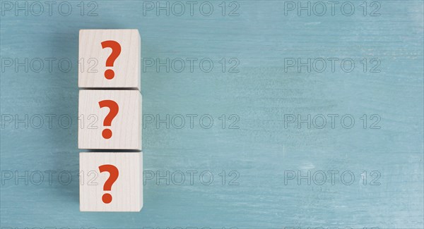 Question marks on wooden cubes, question and answer, meeting and discussion concept, costumer