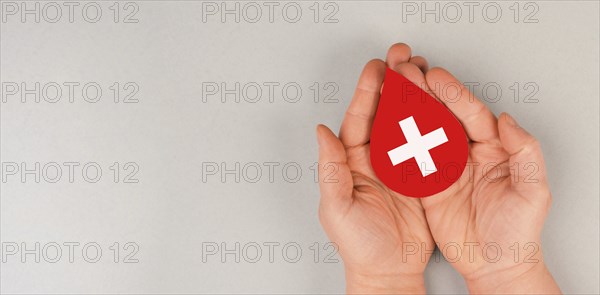Holding drop of blood in the hands, donate plasma, world blood donor day, health care, transfusion,