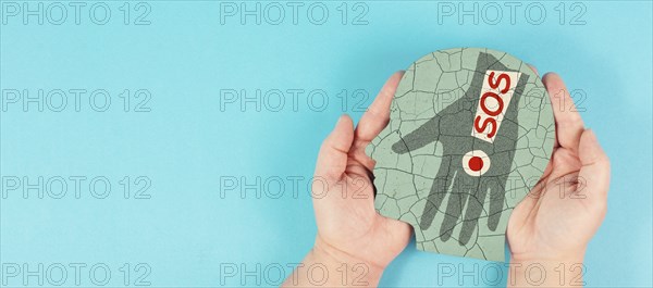 Domestic violence, hand hits face, sos on exclamation mark, international awareness month october