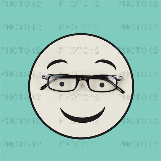 Head with a smiling face and eyeglasses, mental health concept, positive mindset, support and