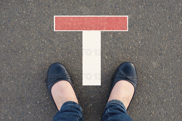 Standing in front of a dead end sign, burn out and depression, personal crisis, impasse of thoughts