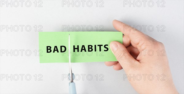 Bad habits sign cut with scissors, break a habit, stop smoking, quit drinking alcohol and unhealthy