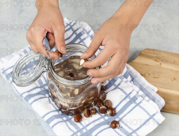 Preparing chestnut liquid soap, cutting buckeye and putting it into a jar with water, alternative