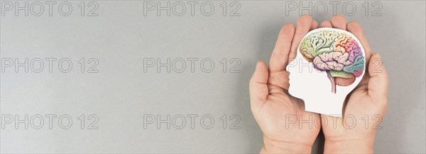Holding a brain in the hands, Parkinson disease, Alzheimer awardness, mental disorder dementia,