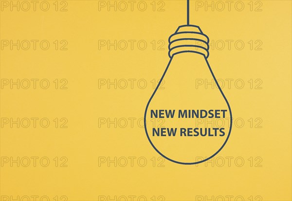 New mindset new results is standing in the light bulb, coaching strategy, optimistic and positive