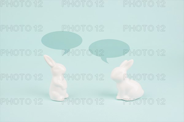 Easter bunny talking together, rabbits have a conversation, spring holiday greeting card with