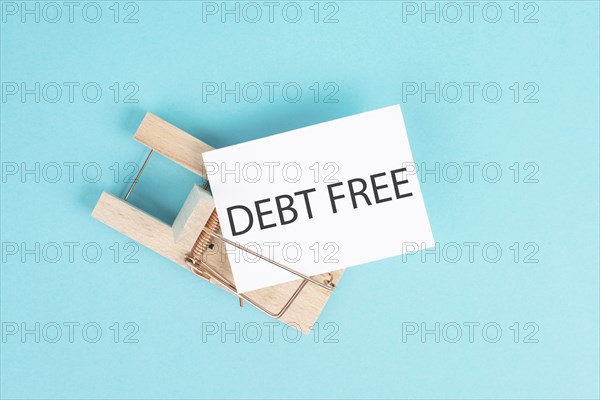Debt free is standing on a paper, ending credit payments and bank loans, financial freedom, trapped