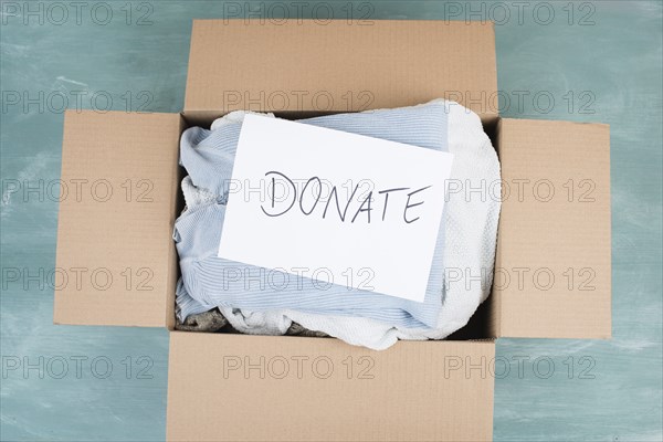 Package with used clothes for donation, second hand use for poor people, welfare and support