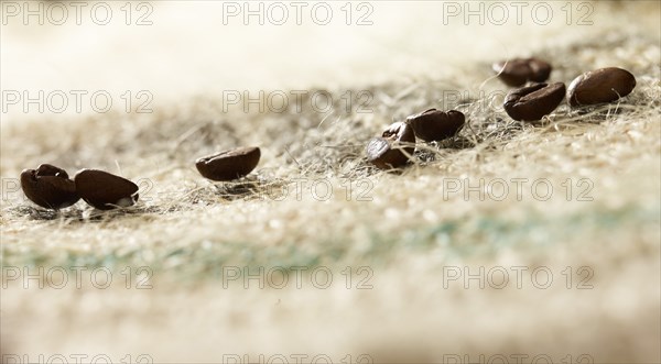 Coffee beans on coffee sack, close-up