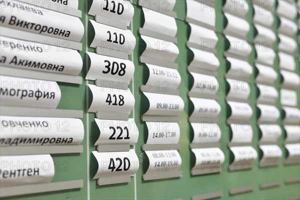 Moscow, Russia, June 23. 2022. Working hours of a doctors and room numbers at registry office in