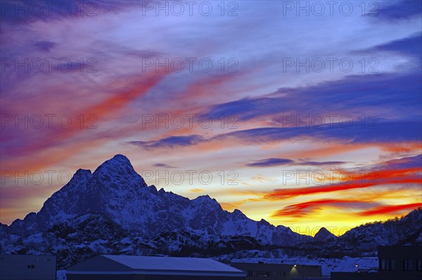 Colourful sunset behind snow-covered mountains, winter, Svolvaer, Lofoten, Nordland, Norway, Europe