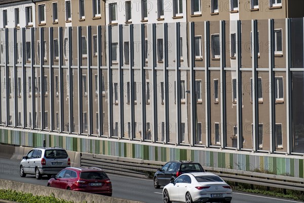 The A40 motorway, Ruhrschnellweg, in Essen, residential buildings directly on the motorway, glass