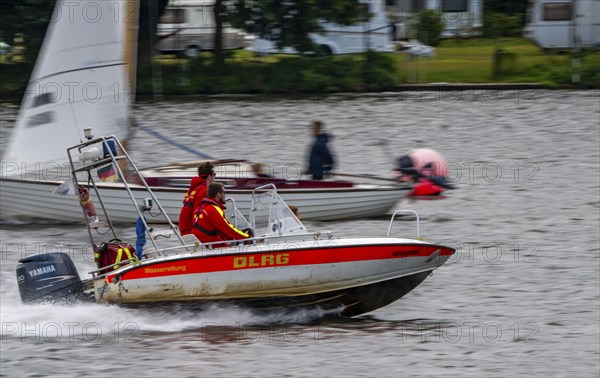 Lake Baldeney, sailing boat, DLRG rescue boat on an alarm trip, Essen, North Rhine-Westphalia,