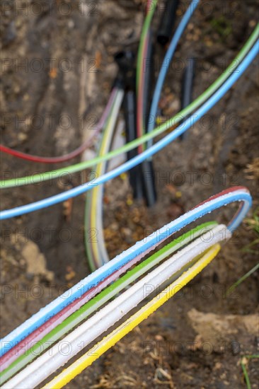 Laying of fibre optic cables, construction site, excavation pit, connection for fast Internet, near