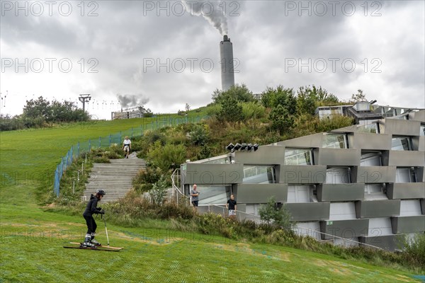 CopenHill, waste incineration plant and artificial ski slope, skiing with a view of the ski lift,
