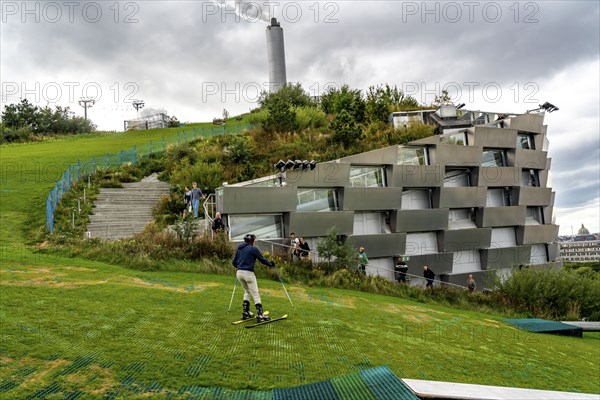 CopenHill, waste incineration plant and artificial ski slope, skiing with a view of the ski lift,