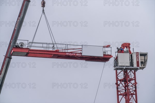 Dismantling of a large construction crane, on a large construction site, housing construction,