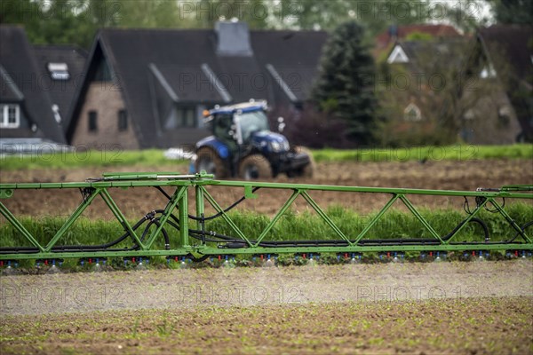 Agriculture, pesticide being sprayed on a field, sugar beet seedlings, North Rhine-Westphalia,