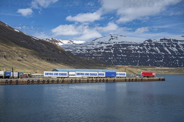 Cargo shipping container at the port harbor of Seydisfjordur, Iceland, view from the distance with