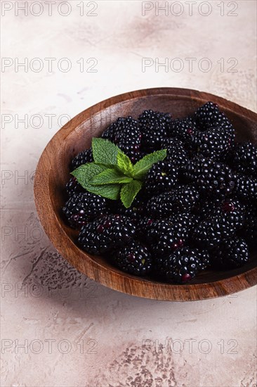 Blackberries, in a wooden bowl, top view, no people