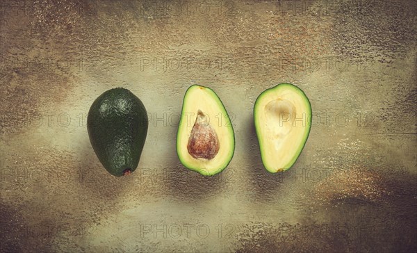 Fresh sliced avocado on the table, top view, food background, concept, menu, food styling