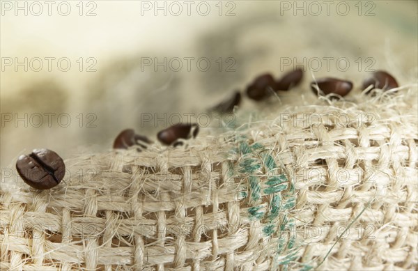 Coffee beans on coffee sack, close-up