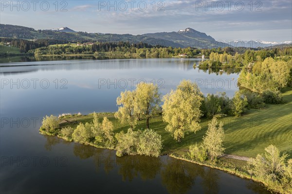 Aerial view over lake Rottachsee towards mountain Grünten, Allgäu, Bavaria, Germany, Europe