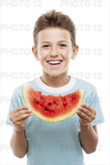 Handsome smiling child boy hand holding red ripe watermelon fruit food slice white isolated