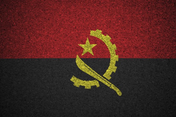 The Angolan flag painted on a cork board