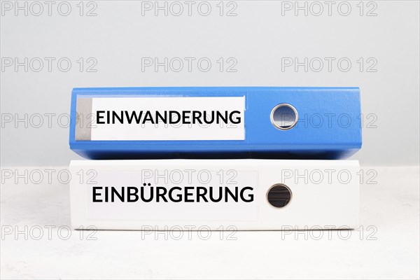 Naturalization and immigration is standing in german language on the folders, new reform immigrants
