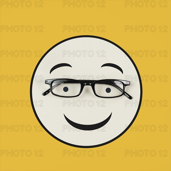 Head with a happy face and eyeglasses, mental health concept, positive mindset, support and