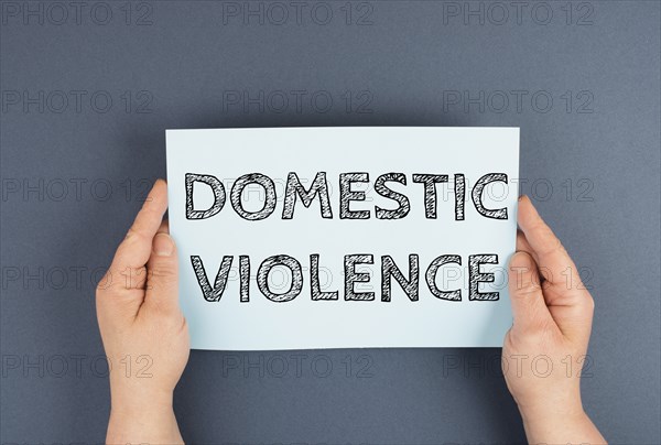 Domestic violence is standing on the paper, international awareness month october for victims and