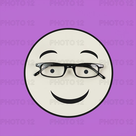 Head with a smiling face and eyeglasses, mental health concept, positive mindset, support and