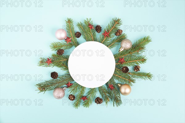 Christmas holiday background, frame with fir branches, baubles, candy cane and cones, winter season